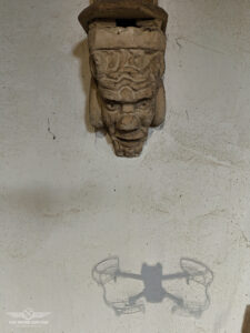 A Gargoyle looks down on our drone as it takes its photograph.
