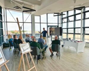 A picture of FMC Drones' Fraser giving a presentation at the Seaview Colonnade